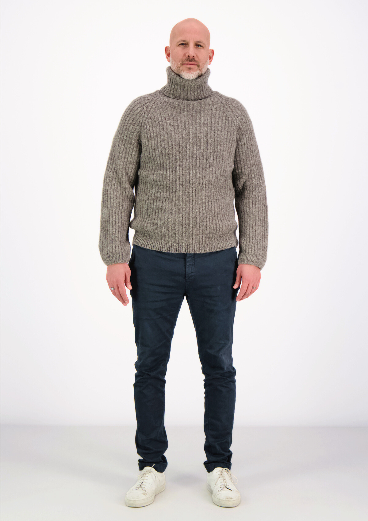 Ribbed grey polo made from Finnish durable sheep wool. Sustainable and warm wool knit made in Finland.