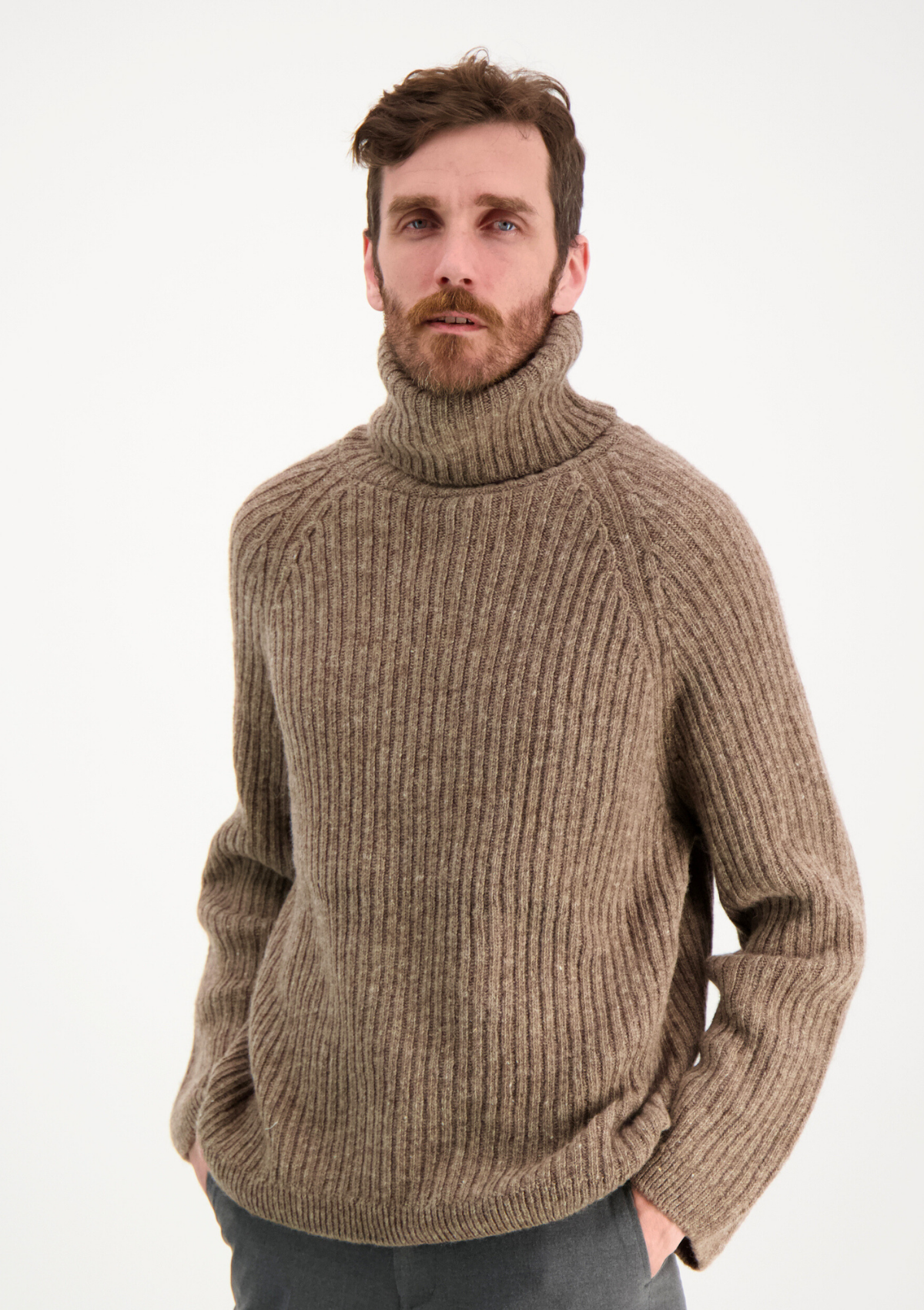 Ribbed beige polo made from Finnish durable sheep wool. Sustainable and warm wool knit made in Finland.