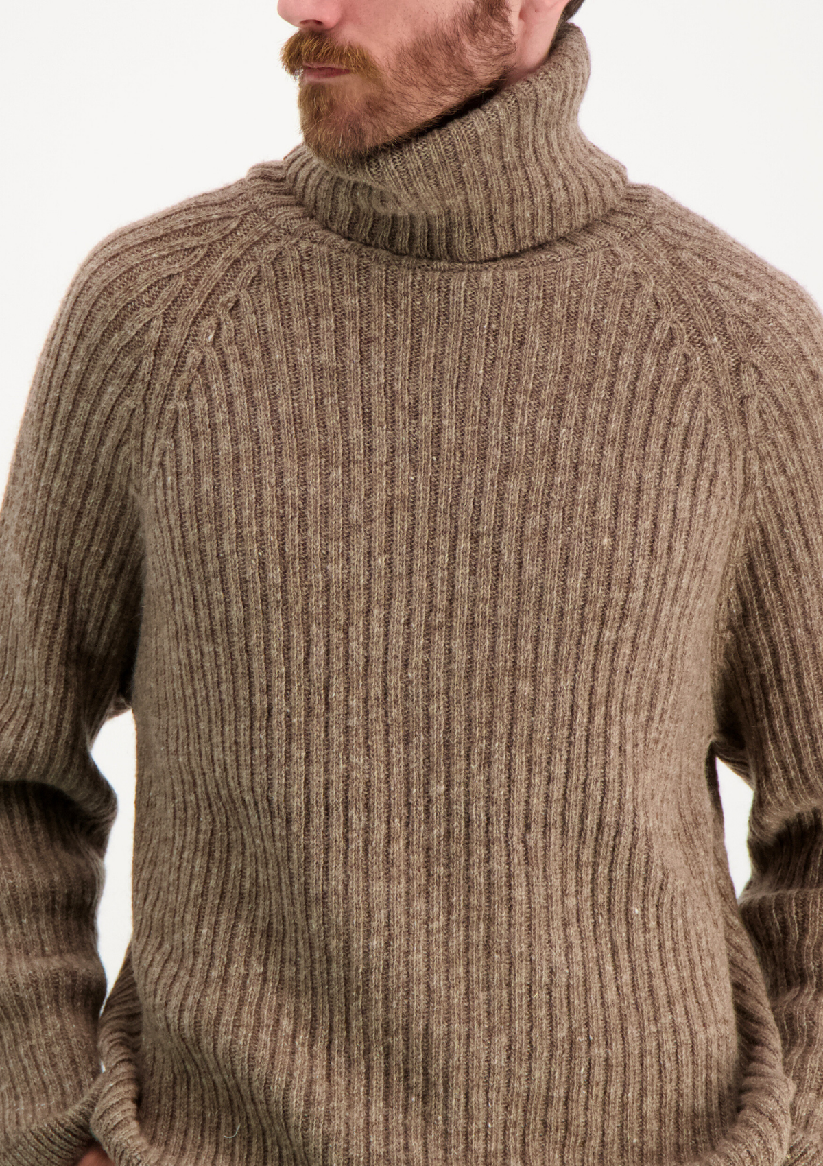 Ribbed beige polo made from Finnish durable sheep wool. Sustainable and warm wool knit made in Finland.