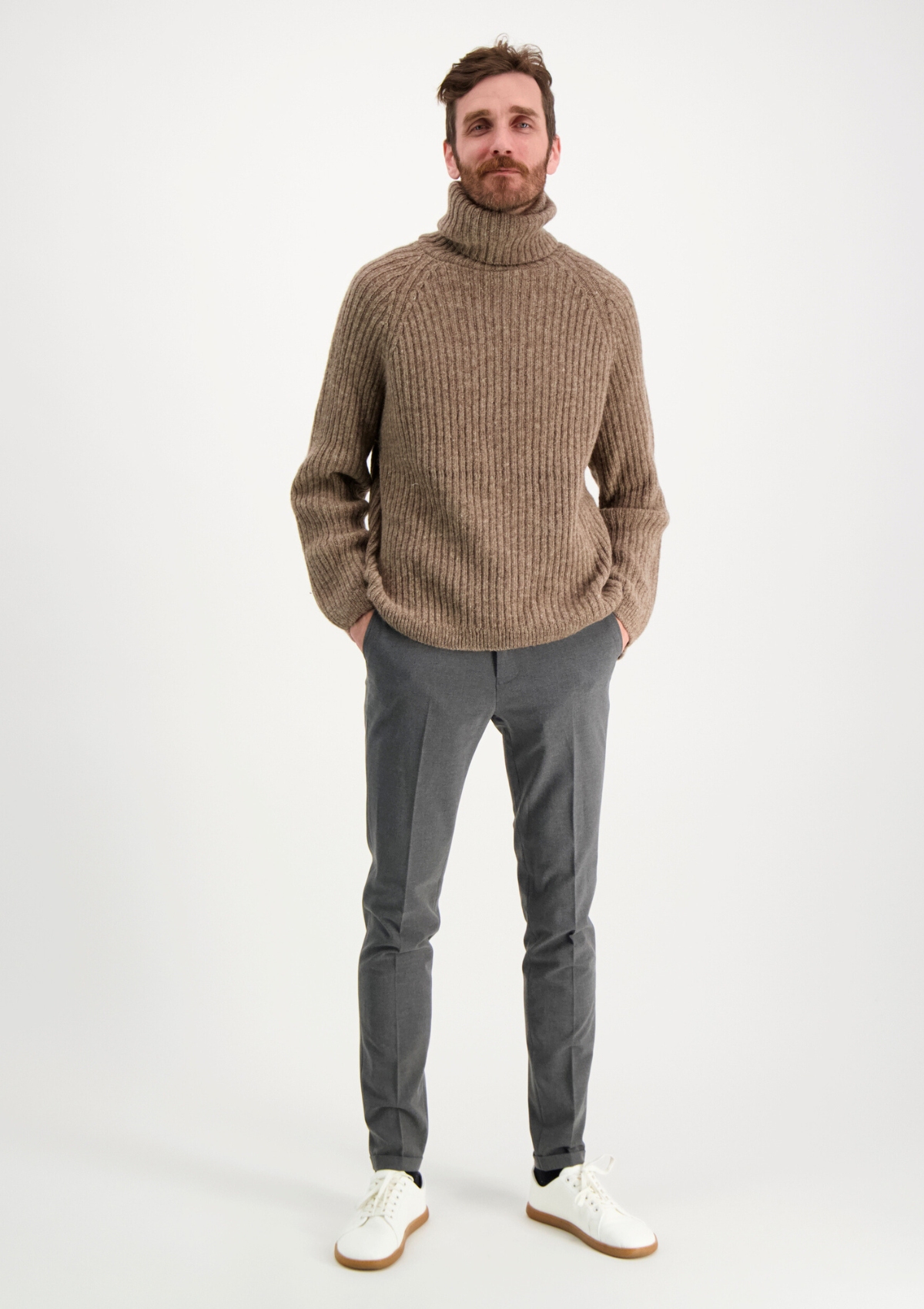 Ribbed beige polo made from Finnish durable sheep wool. Sustainable and warm wool knit made in Finland.