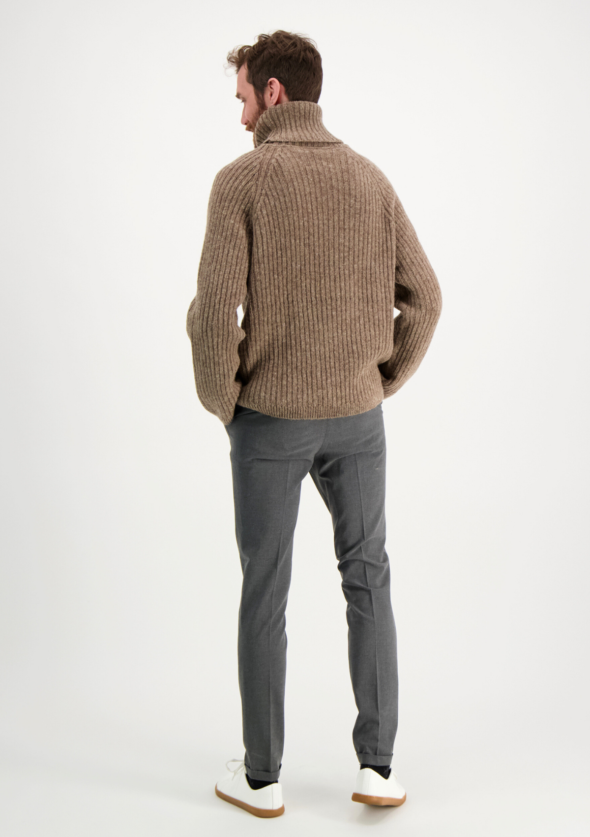 Ribbed beige polo made from Finnish durable sheep wool. Sustainable and warm wool knit made in Finland.