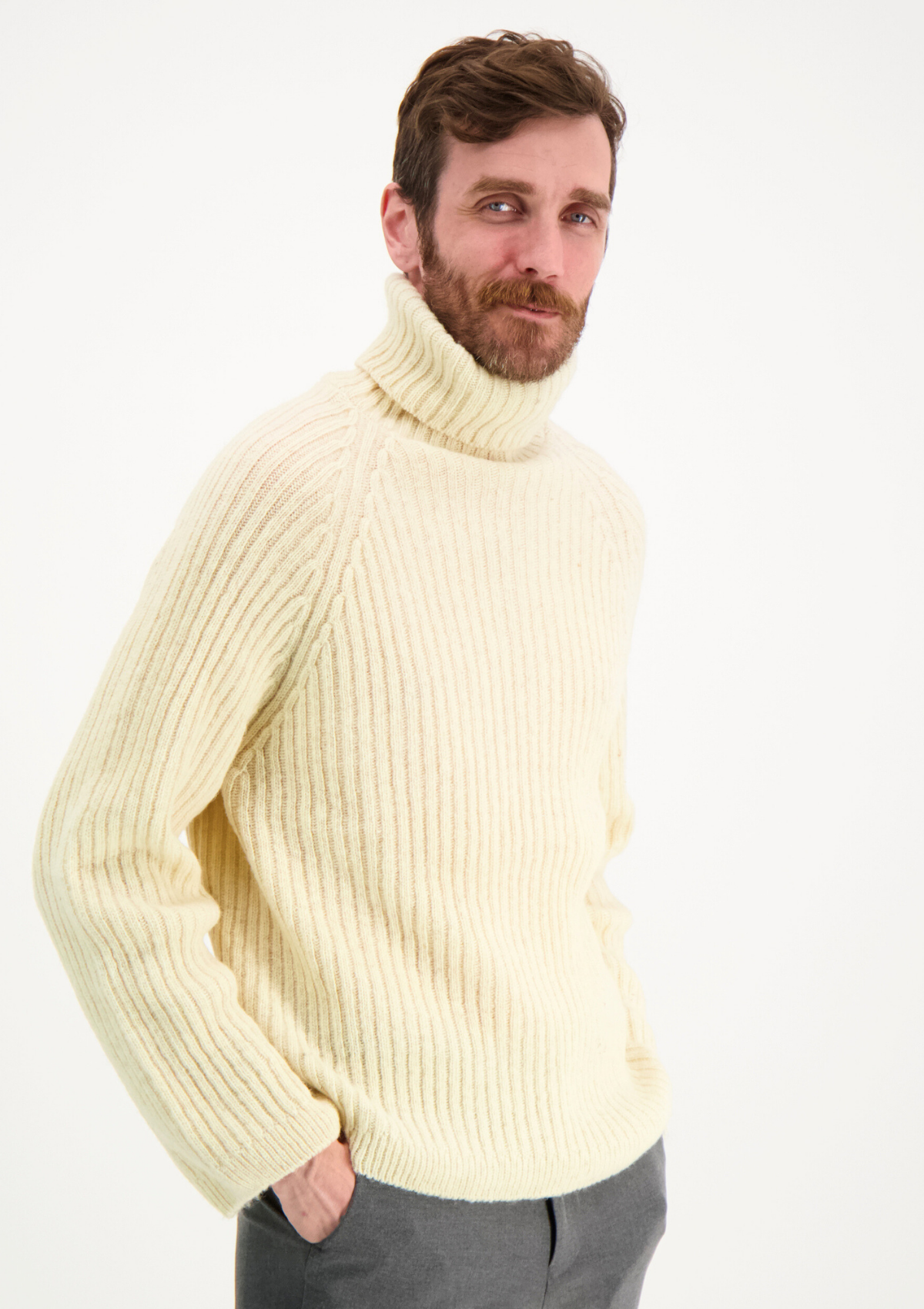 Ribbed white polo made from Finnish durable sheep wool. Sustainable and warm wool knit made in Finland.