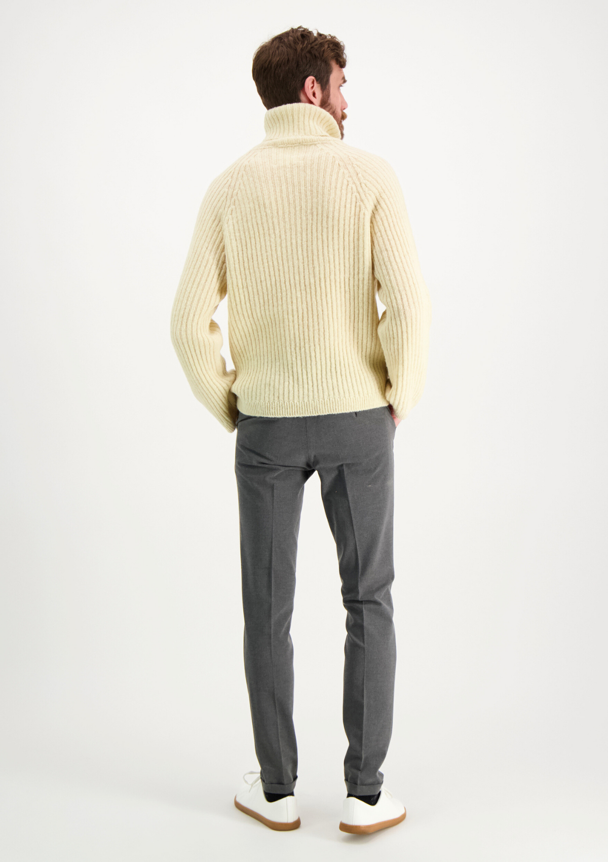 Ribbed white polo made from Finnish durable sheep wool. Sustainable and warm wool knit made in Finland.