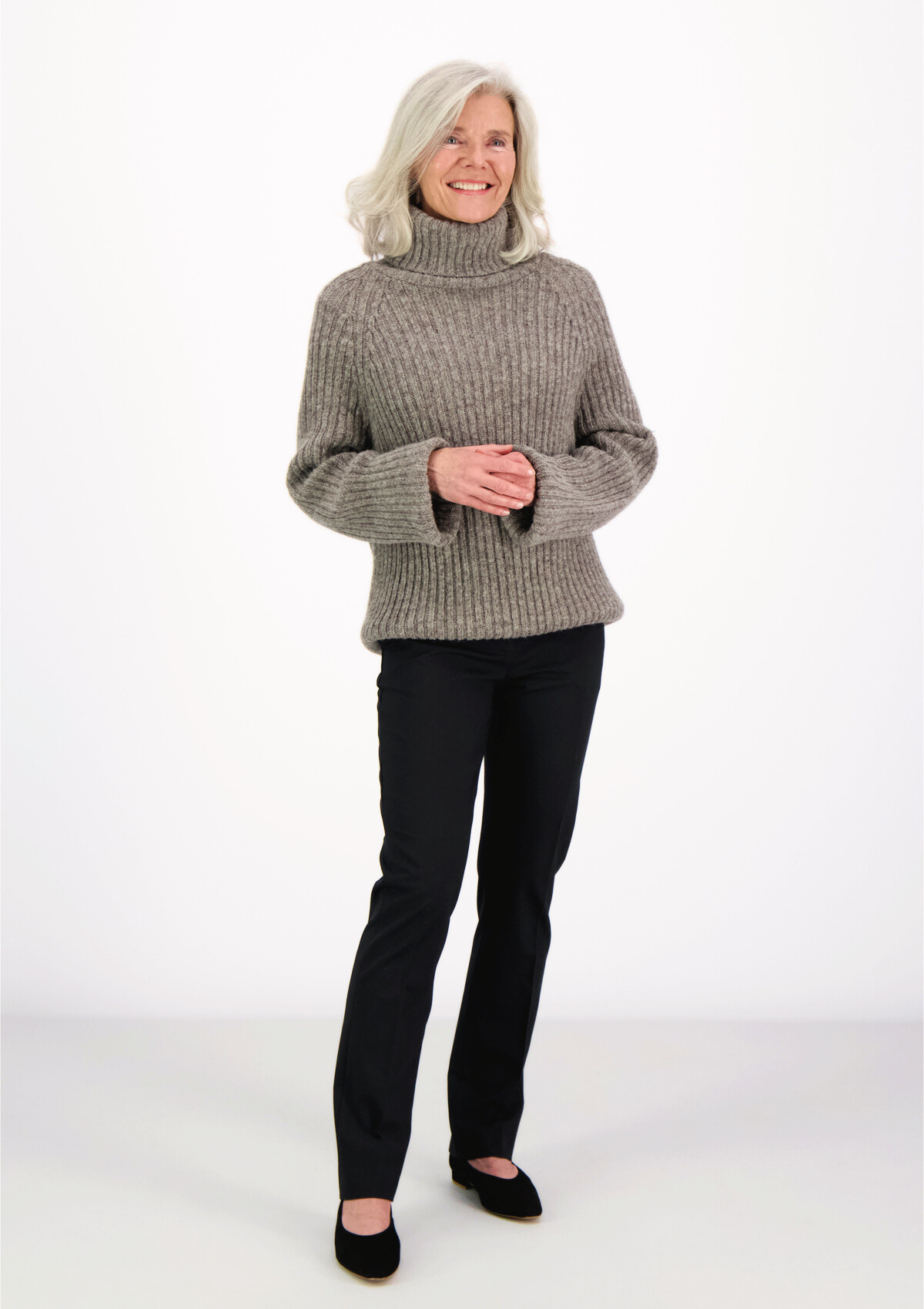 Ribbed grey polo made from Finnish durable sheep wool. Sustainable and warm wool knit made in Finland.