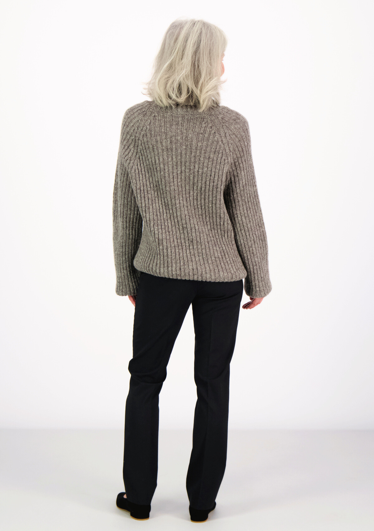 Ribbed grey polo made from Finnish durable sheep wool. Sustainable and warm wool knit made in Finland.