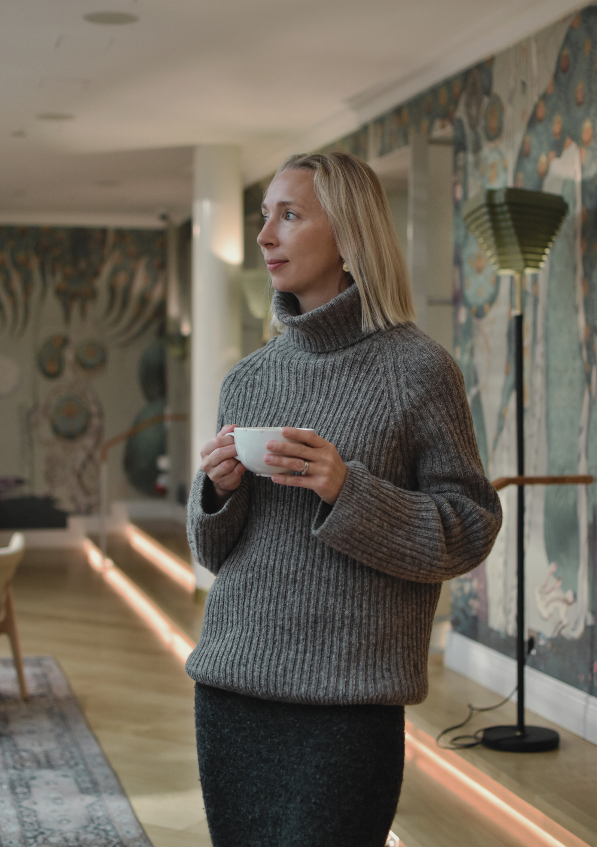 Ribbed grey polo made from Finnish durable sheep wool. Sustainable and warm wool knit made in Finland.