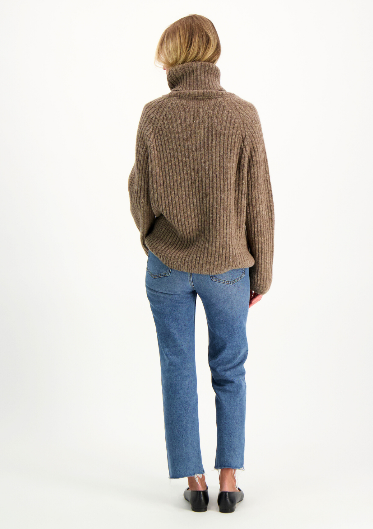 Ribbed beige polo made from Finnish durable sheep wool. Sustainable and warm wool knit made in Finland.