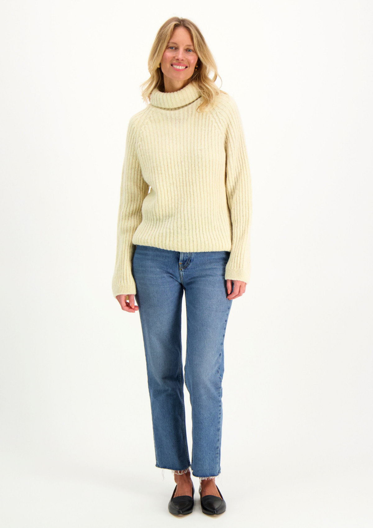 Ribbed white polo made from Finnish durable sheep wool. Sustainable and warm wool knit made in Finland.