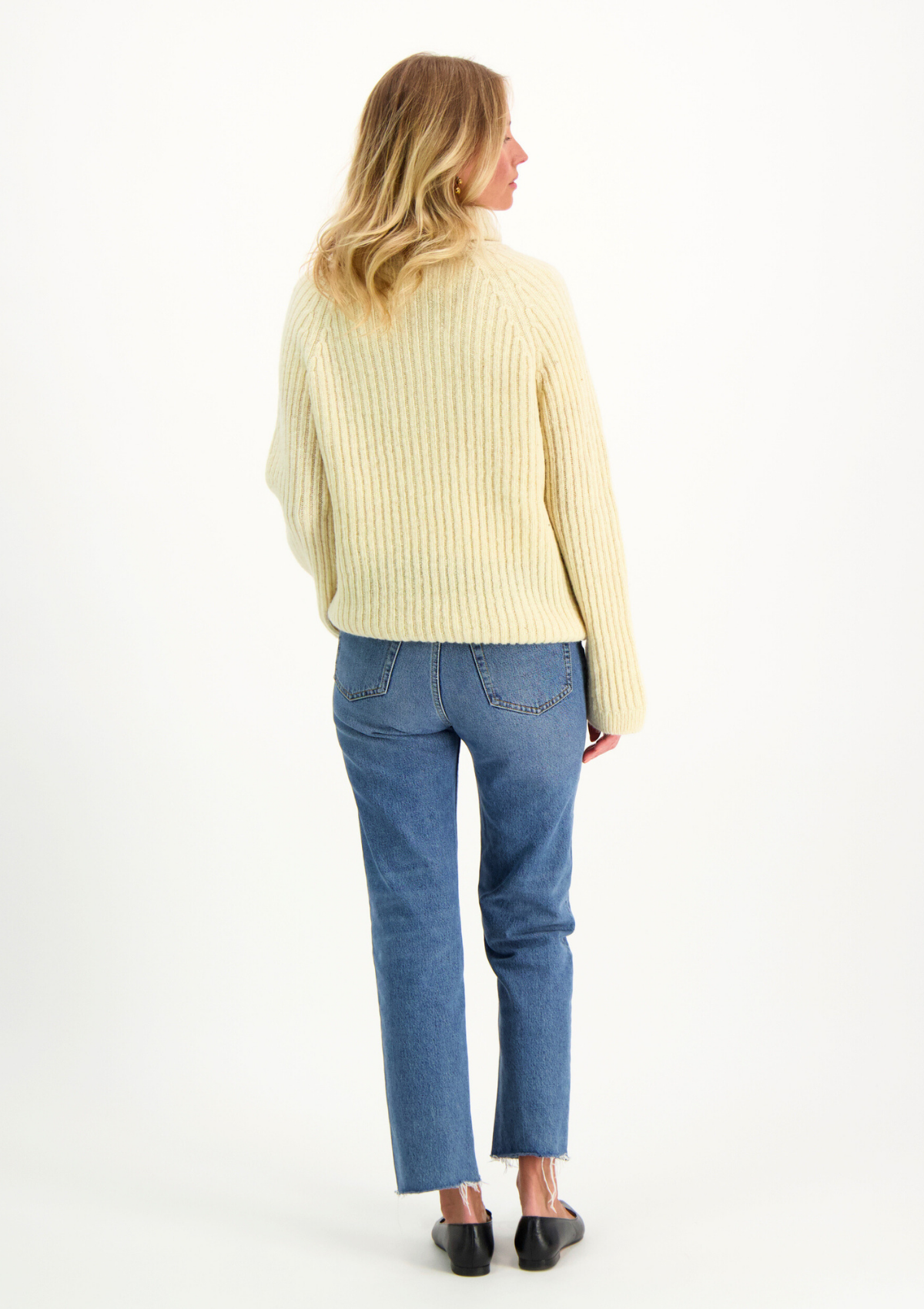 Ribbed white polo made from Finnish durable sheep wool. Sustainable and warm wool knit made in Finland.