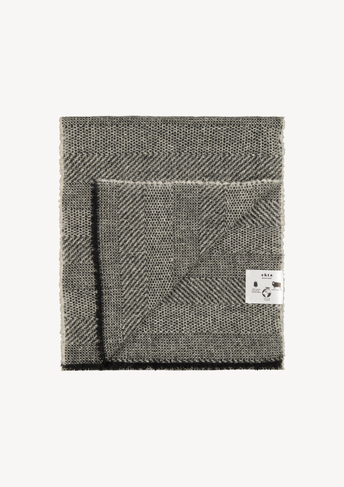 Black textured scarf made mostly out of responsible Finnish wool. Manufactured in Finland.