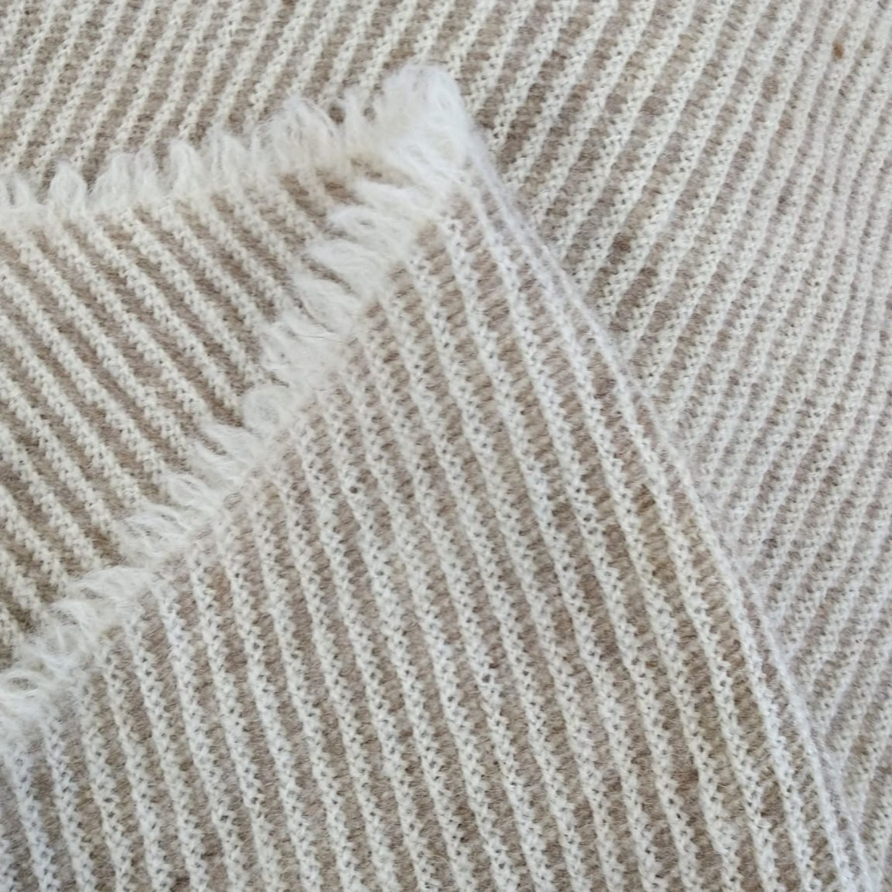 Diagonal striped wool blanket for babies or dogs, made from 100% Finnish wool.