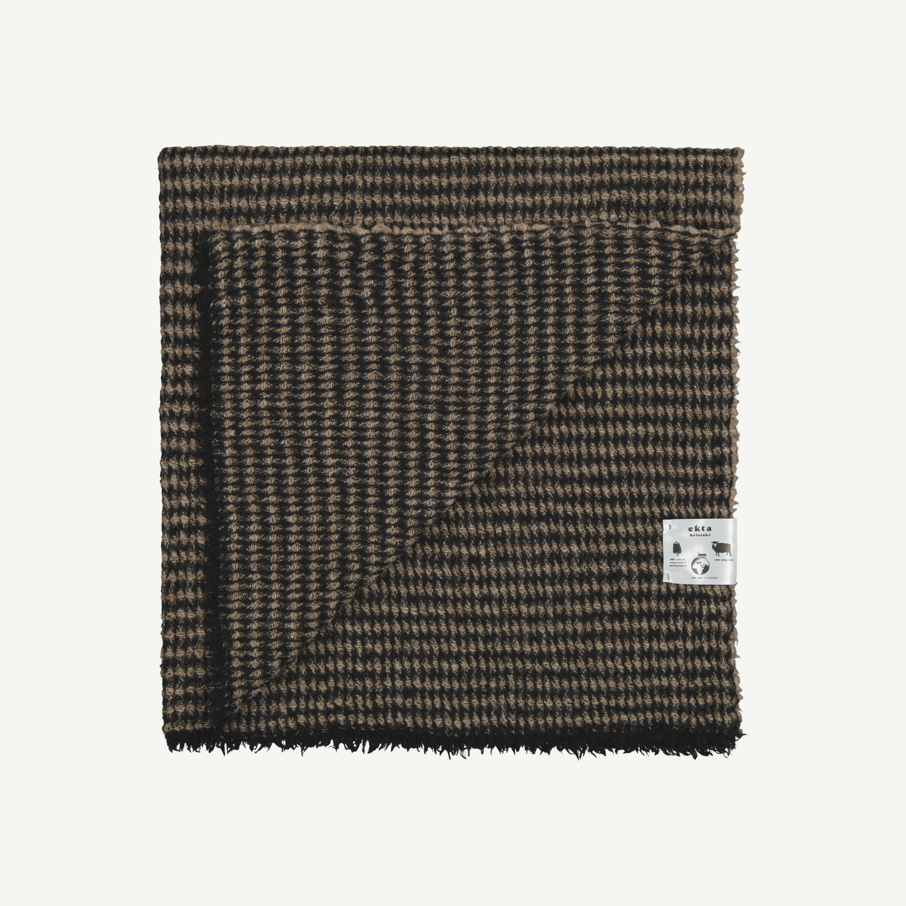 Beige and black colored goose eye patterned wool shawl made from Finnish sheep wool and manufactured in Finland.