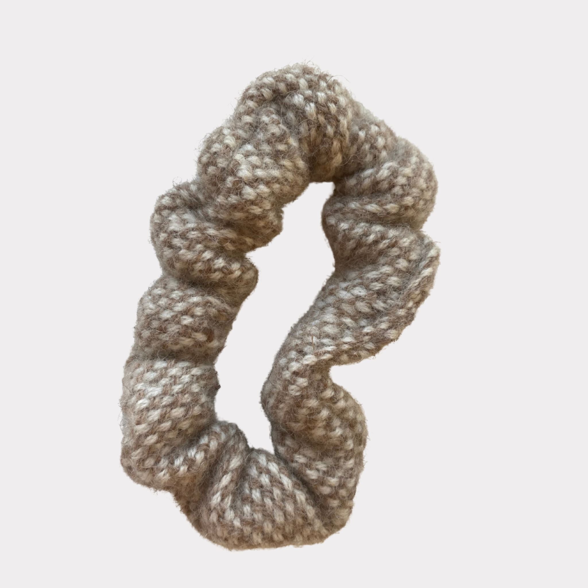 Ekta Helsinki wool scrunchies are gentle and warm for the hair and head. Made in Helsinki, material Finnish sheep wool. Come in beige and brown and large and smaller size.
