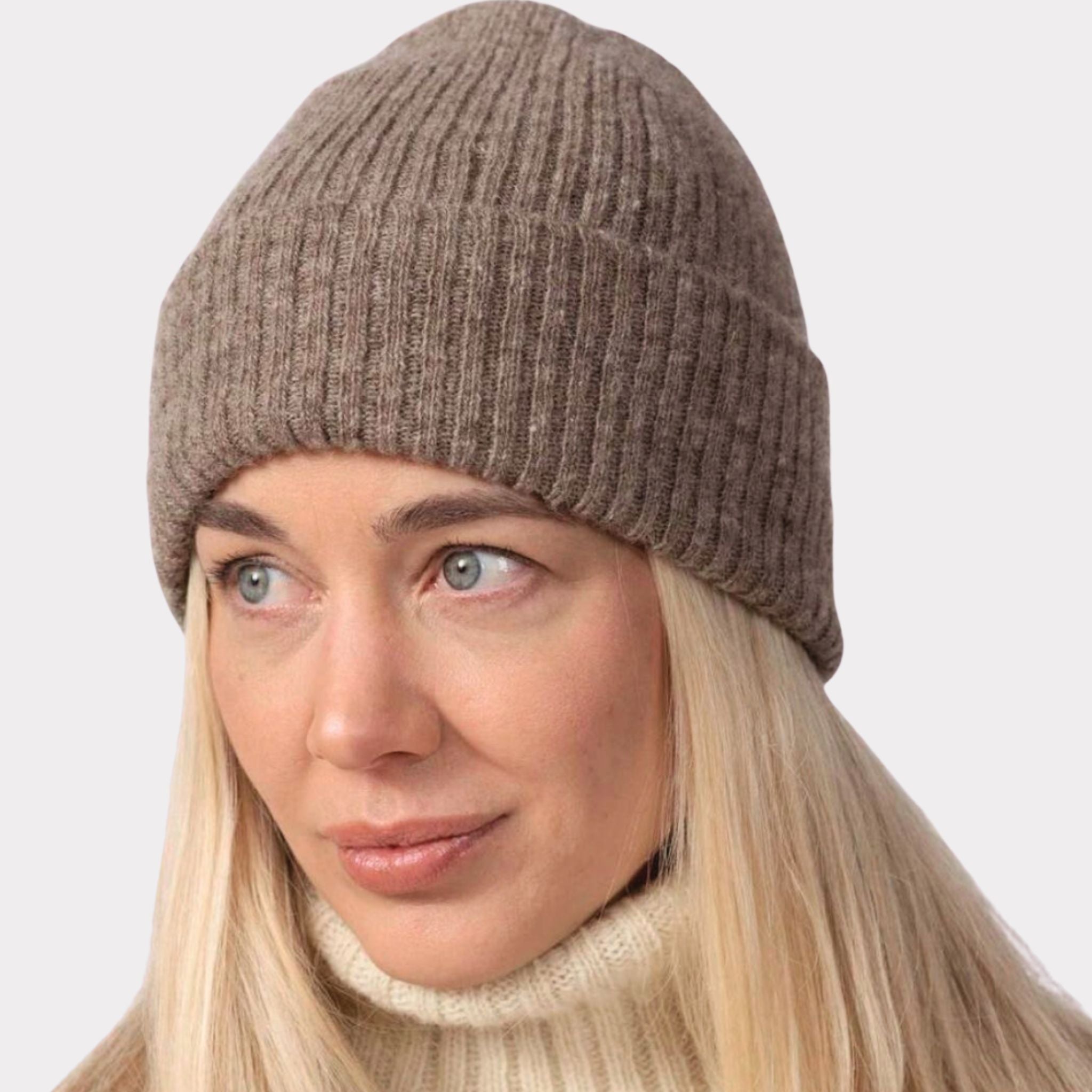 Beige thin ribbed beanie made from responsible Finnish sheep wool. Manufactured in Finland.