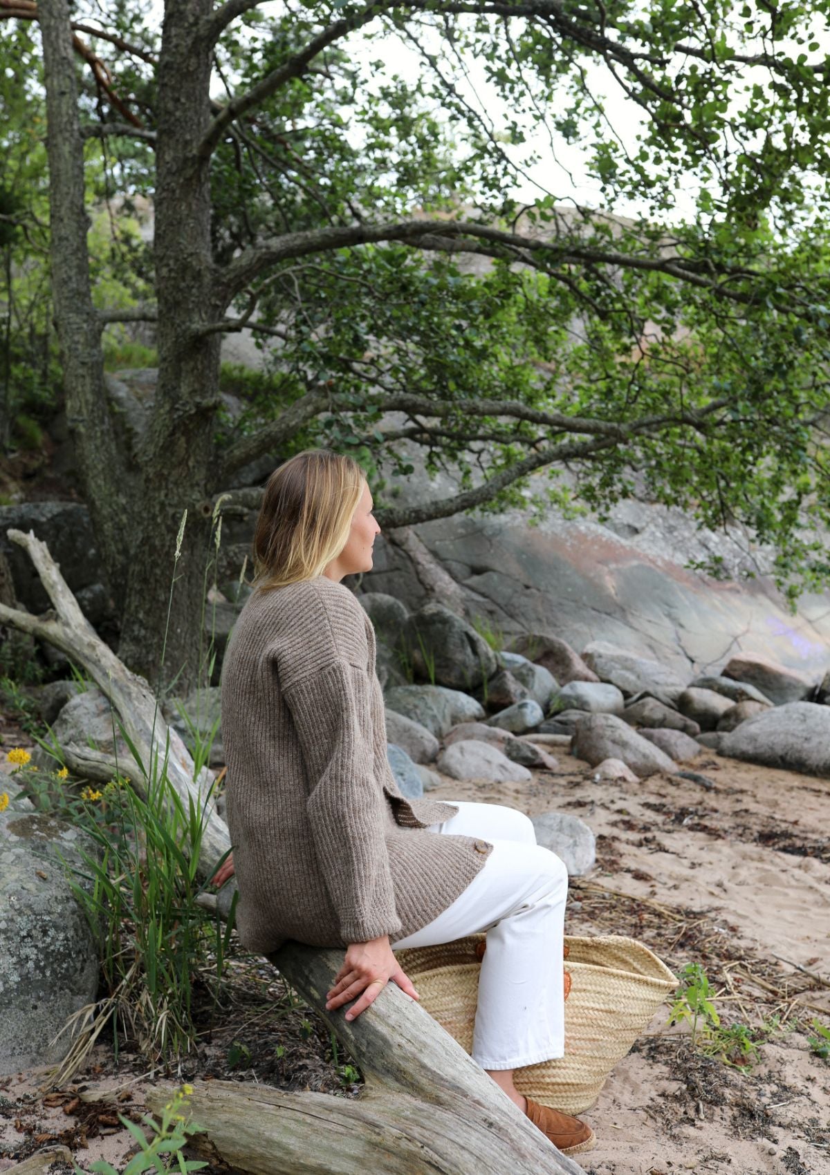 Ribbed longer beige v-neck cardigan with relaxed fit. Made of responsible Finnish sheep wool in Finland.