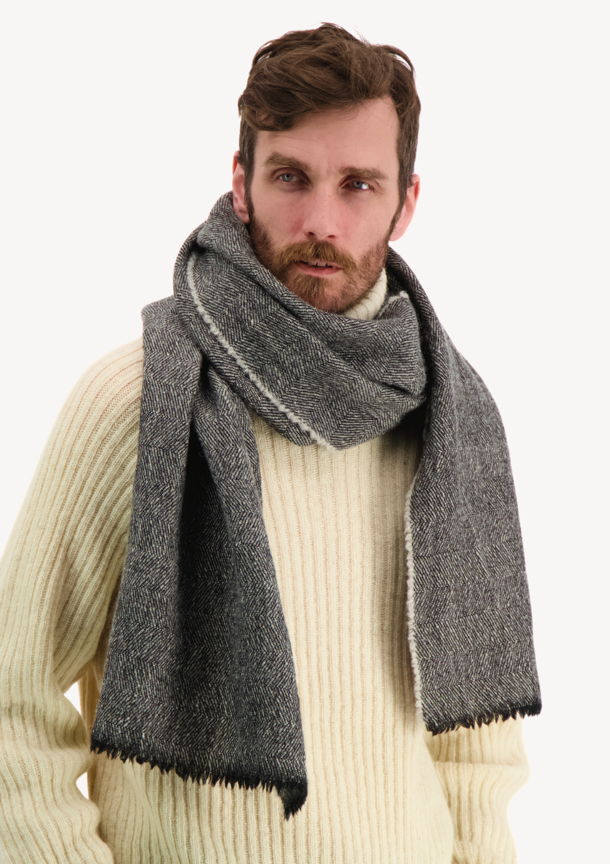 Black herringbone scarf made mostly out of responsible Finnish sheep wool. Manufactured in Finland.