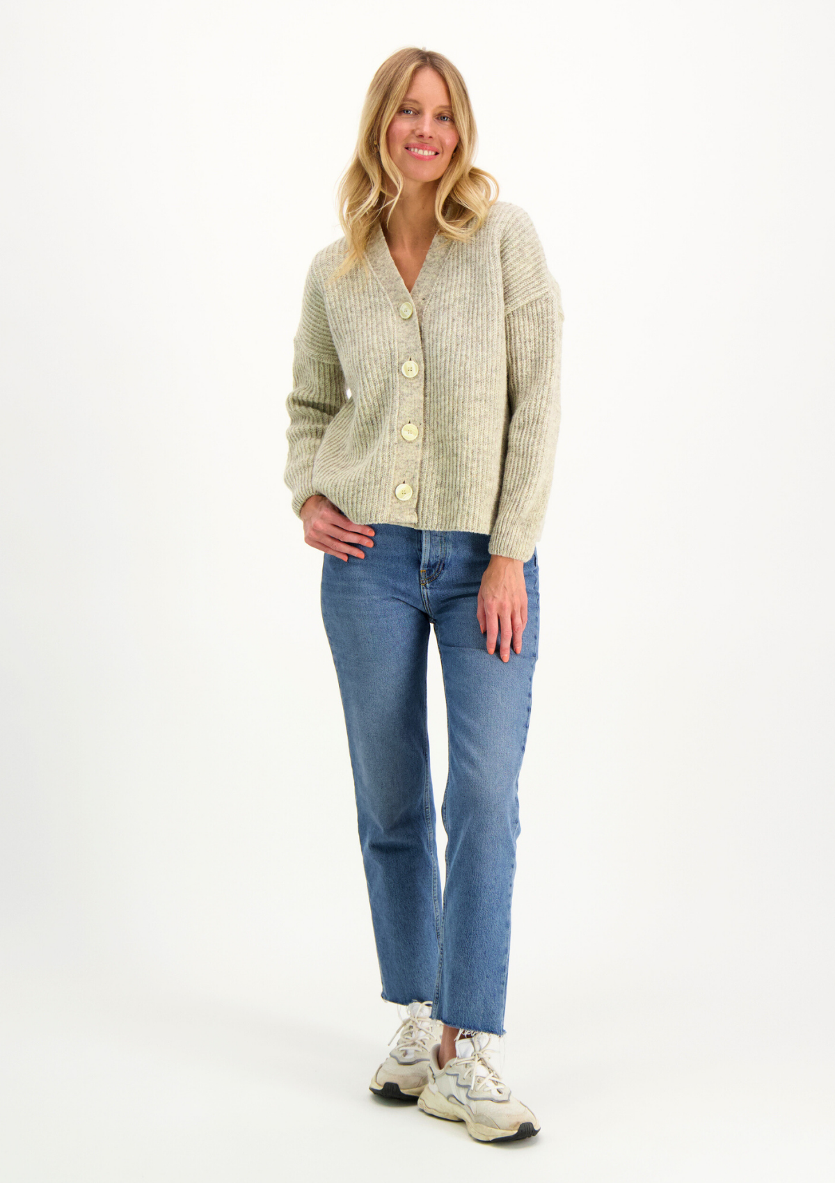 Light grey cardigan responsibly made in Finland from Finnish sheep wool.