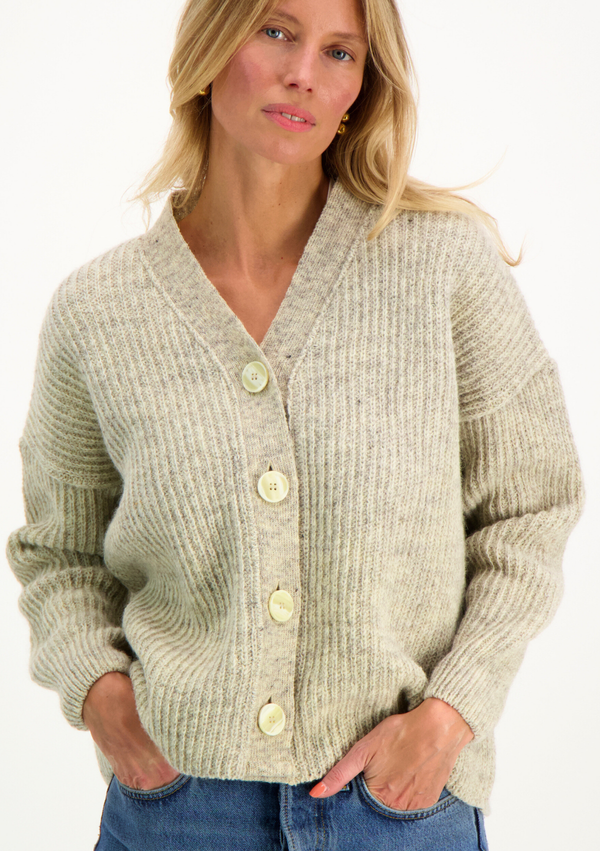 Light grey cardigan responsibly made in Finland from Finnish sheep wool.