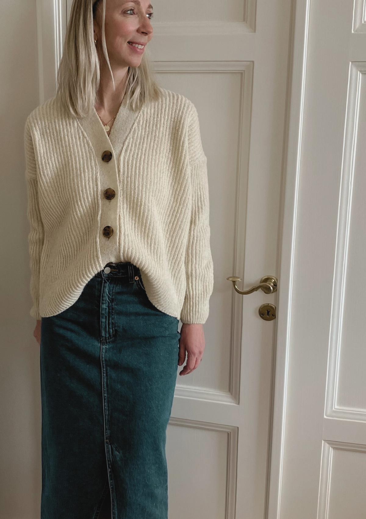 White ribbed cardigan made in Finland from Finnish sheep wool. Sustainable and ethical.