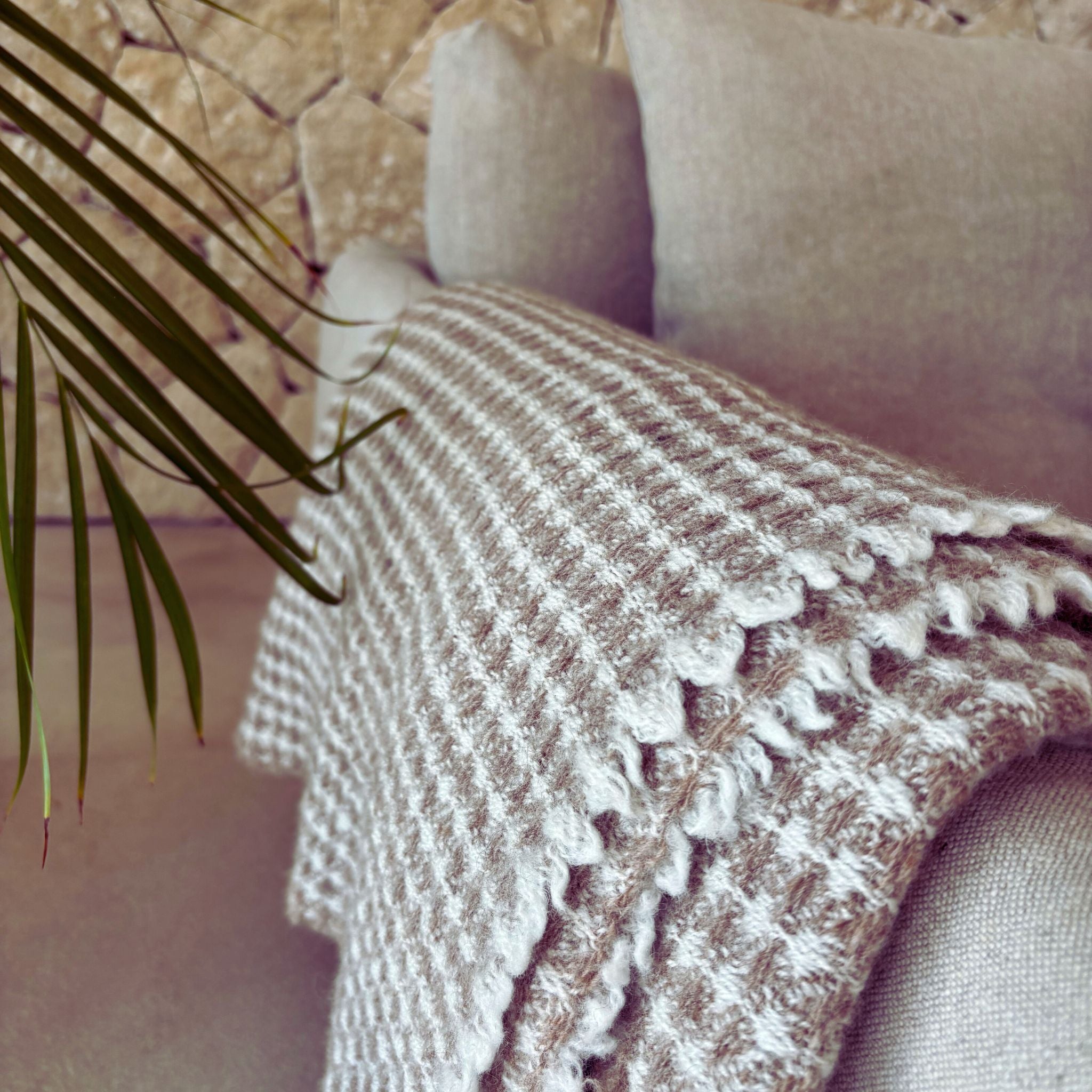 Goose eye Finnish wool blanket from Ekta Helsinki in beige and white. Manufactured responsibly in Finland. Use for outside or inside both summer and winter.