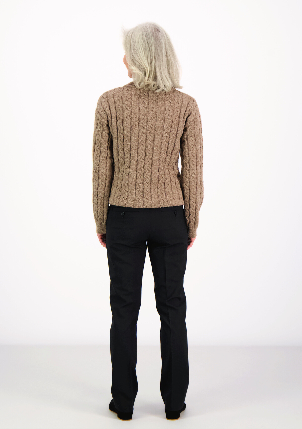 Soft and elegant cable knit in beige with o-neck. Made of responsible Finnish sheep wool in Finland.