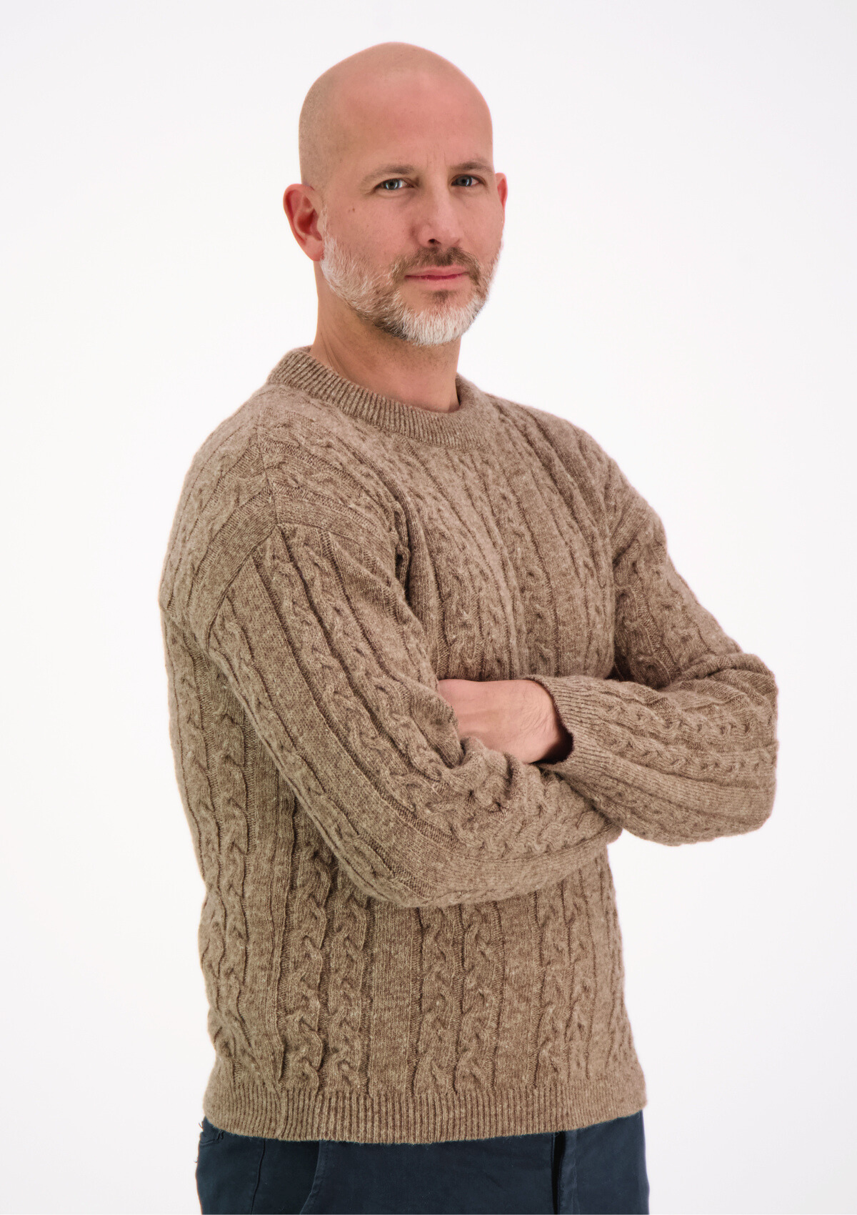 Soft and elegant cable knit in beige with o-neck. Made of responsible Finnish sheep wool in Finland.