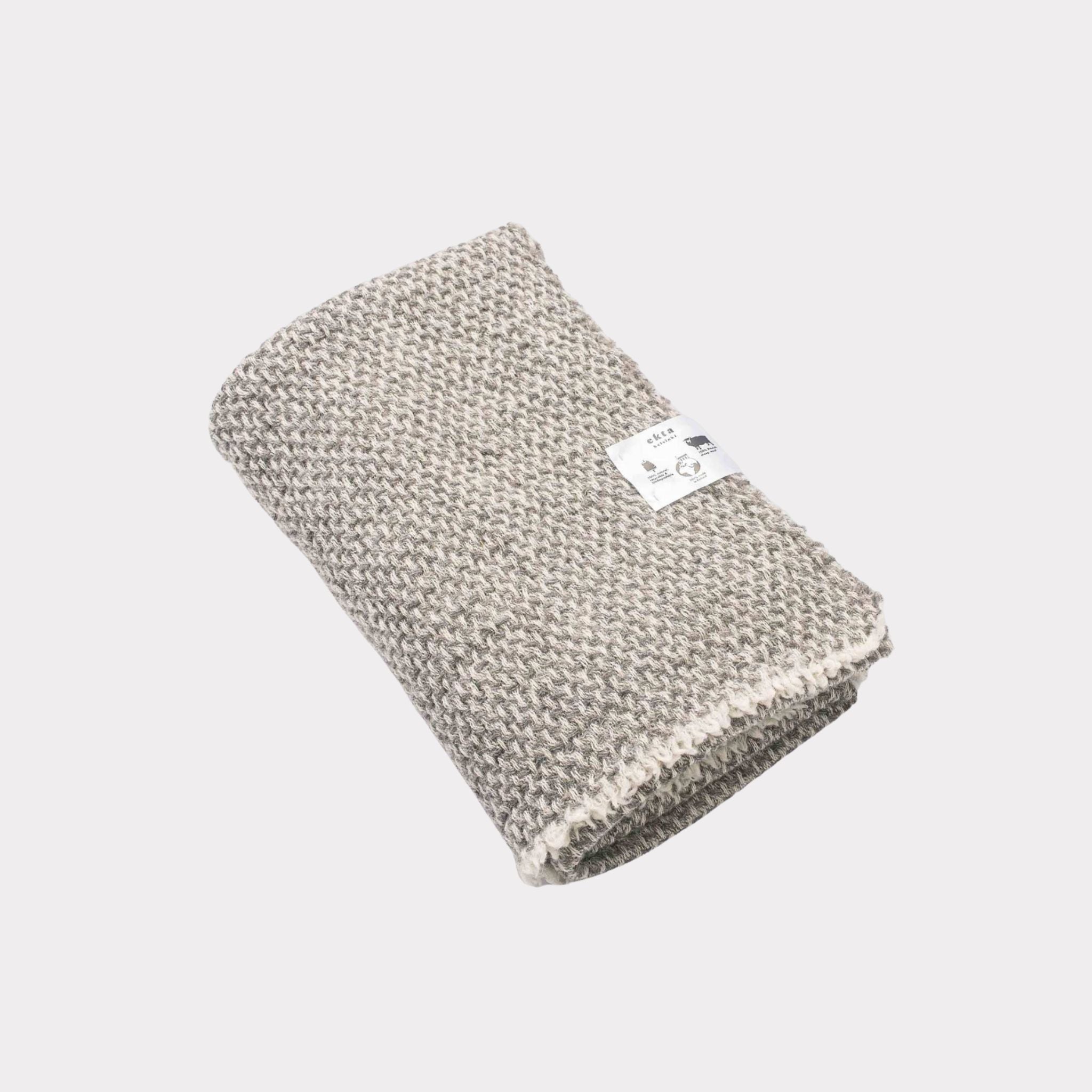Textured white and grey throw made from responsibly sourced Finnish sheep wool, manufactured in Finland.