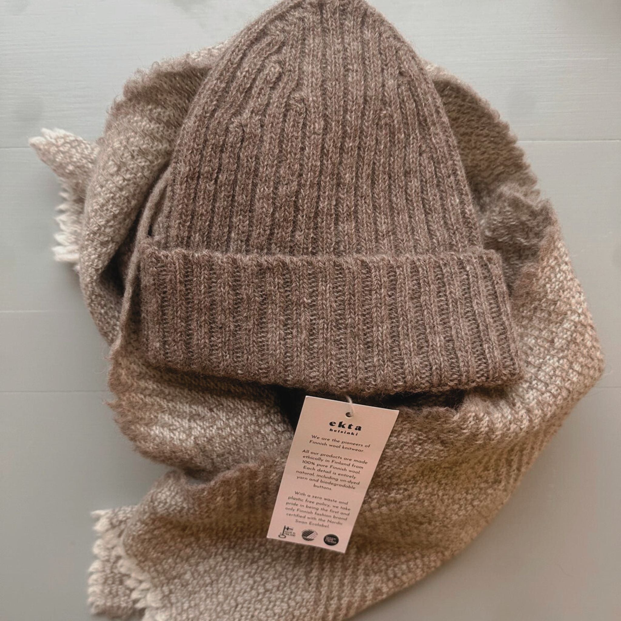 Soft, durable wool beanie and wool scarf made in Finland, featuring a minimalist Nordic design.