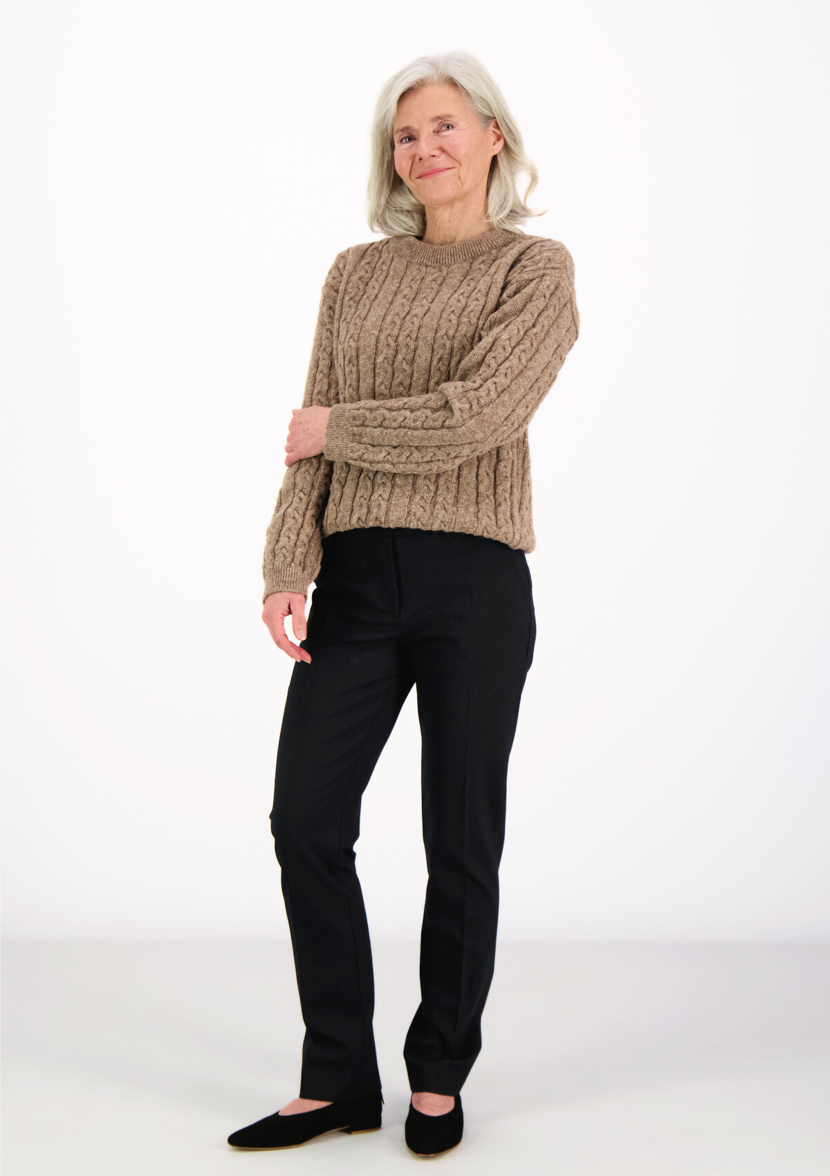 Soft and elegant cable knit in beige with o-neck. Made of responsible Finnish sheep wool in Finland.