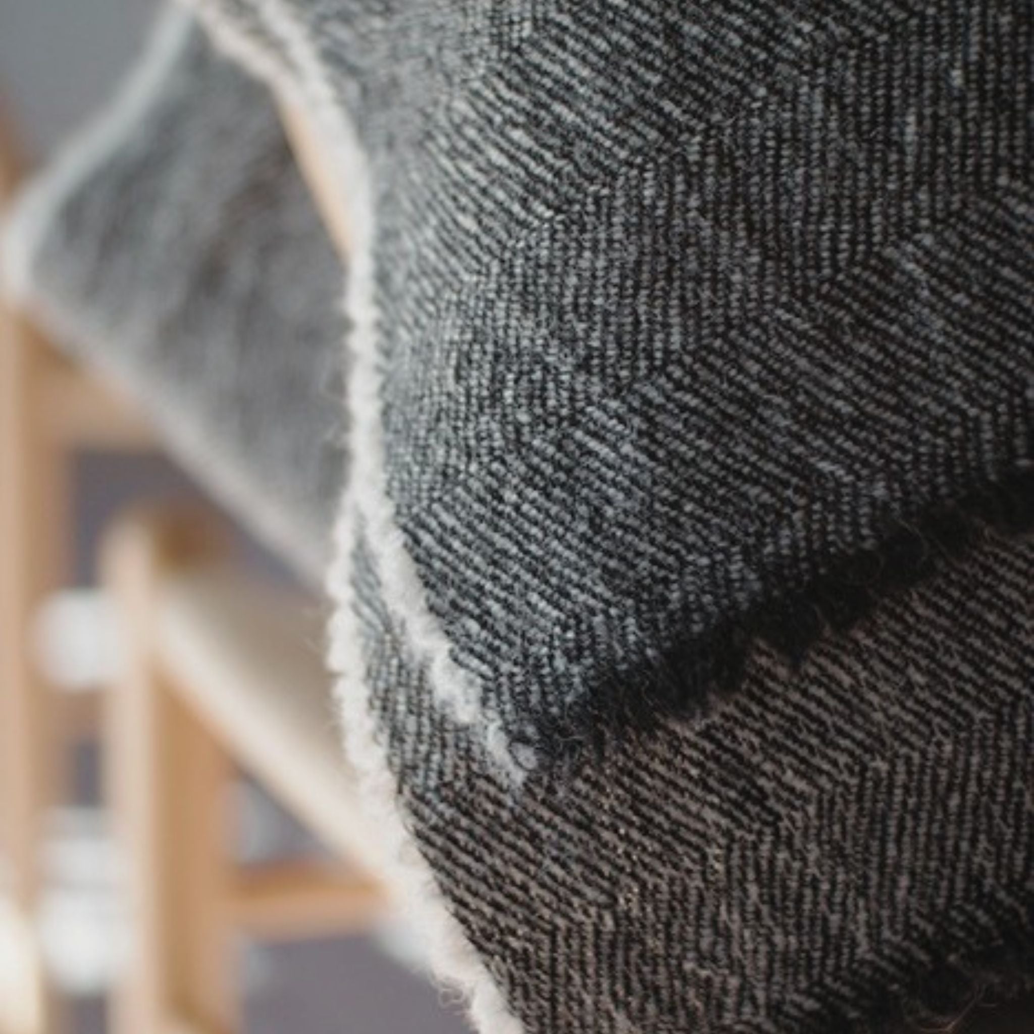 Black herringbone scarf made mostly out of responsible Finnish sheep wool. Manufactured in Finland.