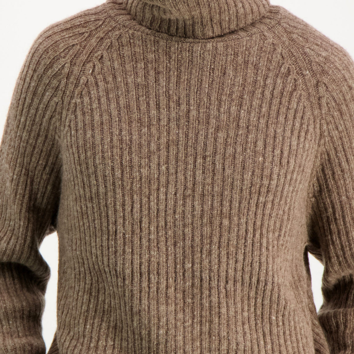 Ribbed beige polo made from Finnish durable sheep wool. Sustainable and warm wool knit made in Finland. 