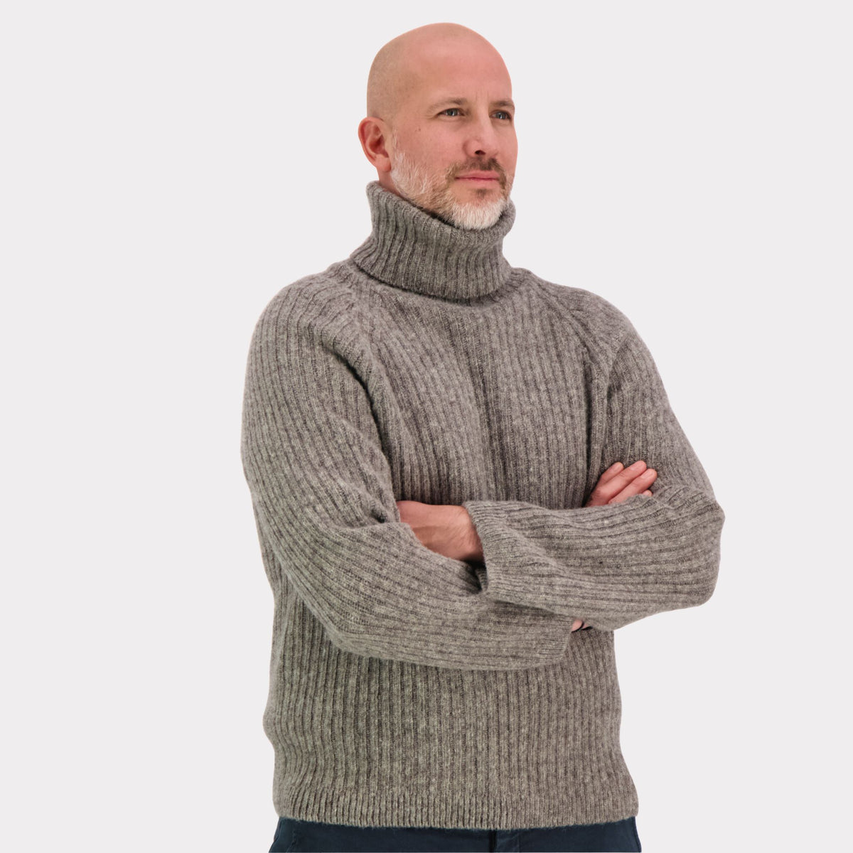 Ribbed grey polo made from Finnish durable sheep wool. Sustainable and warm wool knit made in Finland. 