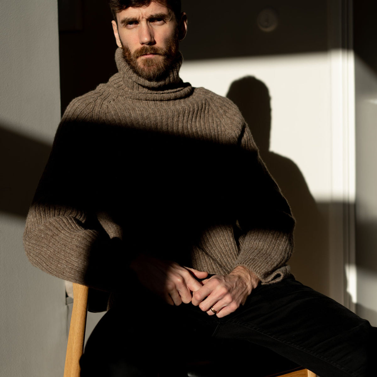 Ribbed beige polo made from Finnish durable sheep wool. Sustainable and warm wool knit made in Finland. 