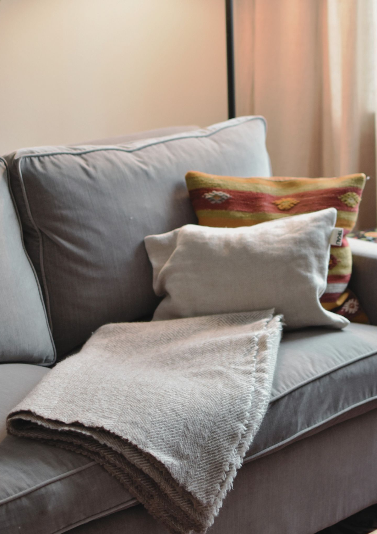 Herringbone pattern white and grey colored throw made out of responsible Finnish sheep wool. Manufactured in Finland.  