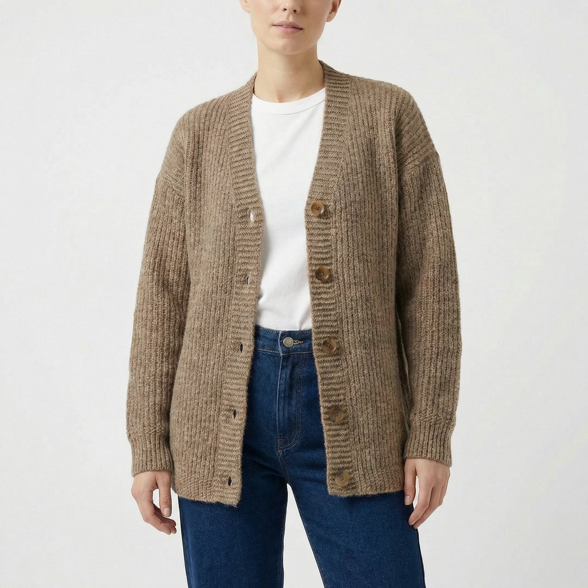 Ribbed longer beige v-neck cardigan with relaxed fit. Made of responsible Finnish sheep wool in Finland. 
