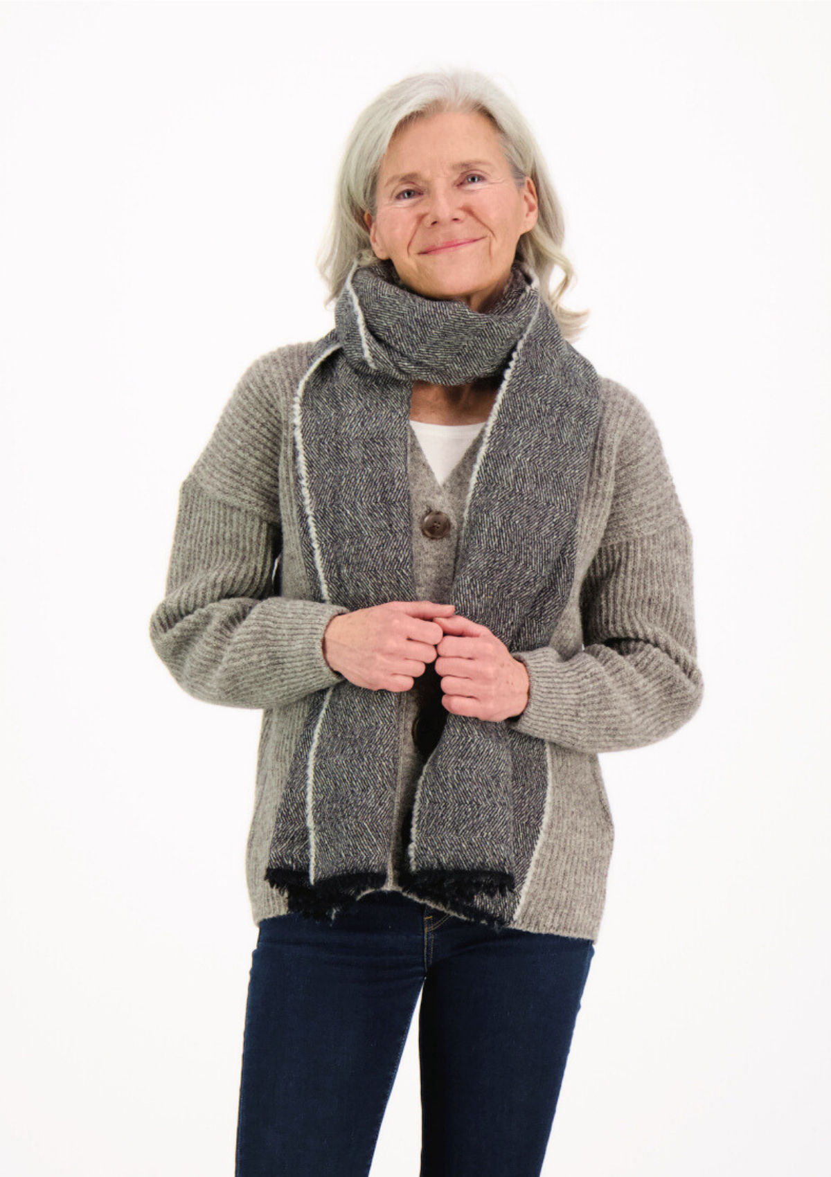 Black herringbone scarf made mostly out of responsible Finnish sheep wool. Manufactured in Finland. 