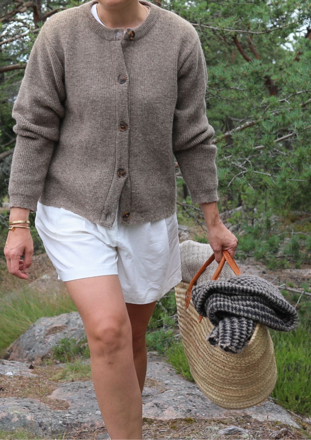 Elsa cardigan with a round neck in beige color. Manufactured responsibly in Finland using local wool. 
