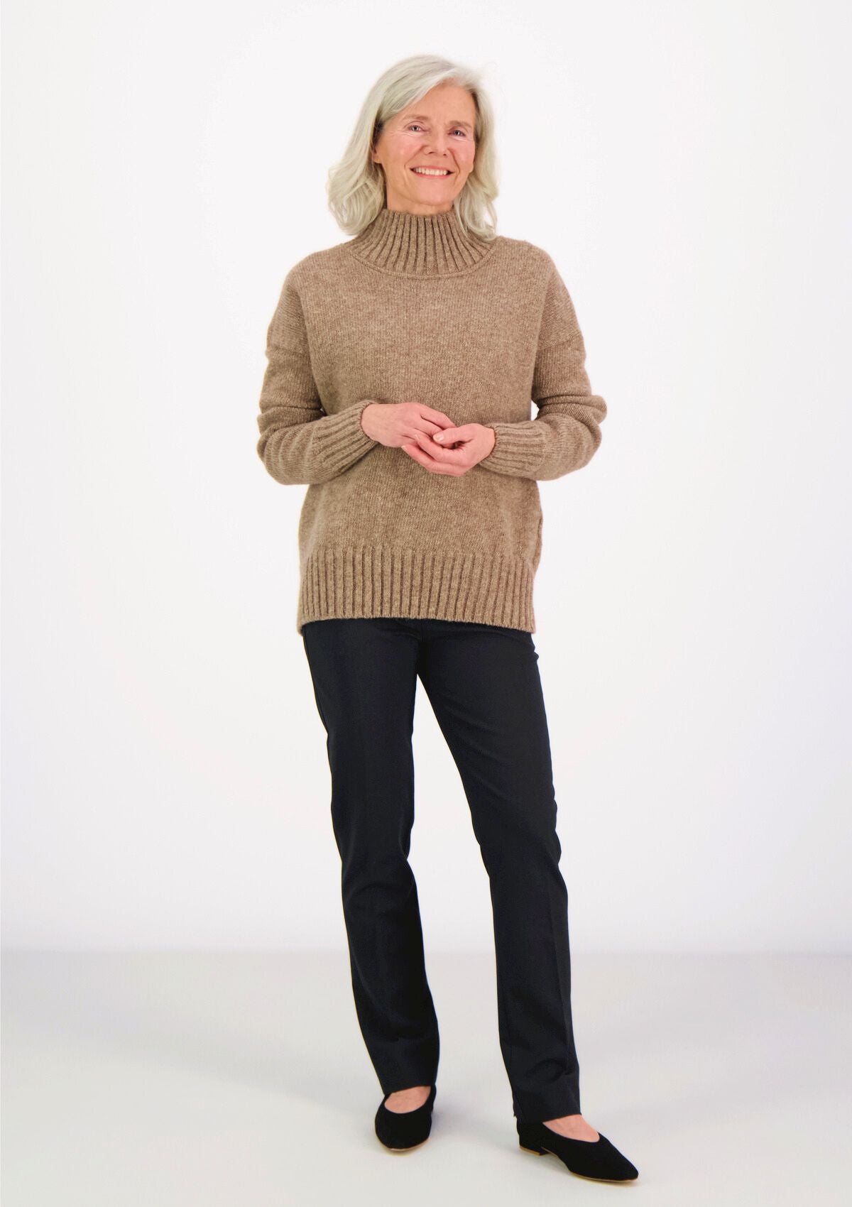 Beige responsible funnel-neck knit made out of Finnish sheep wool, manufactured in Finland.