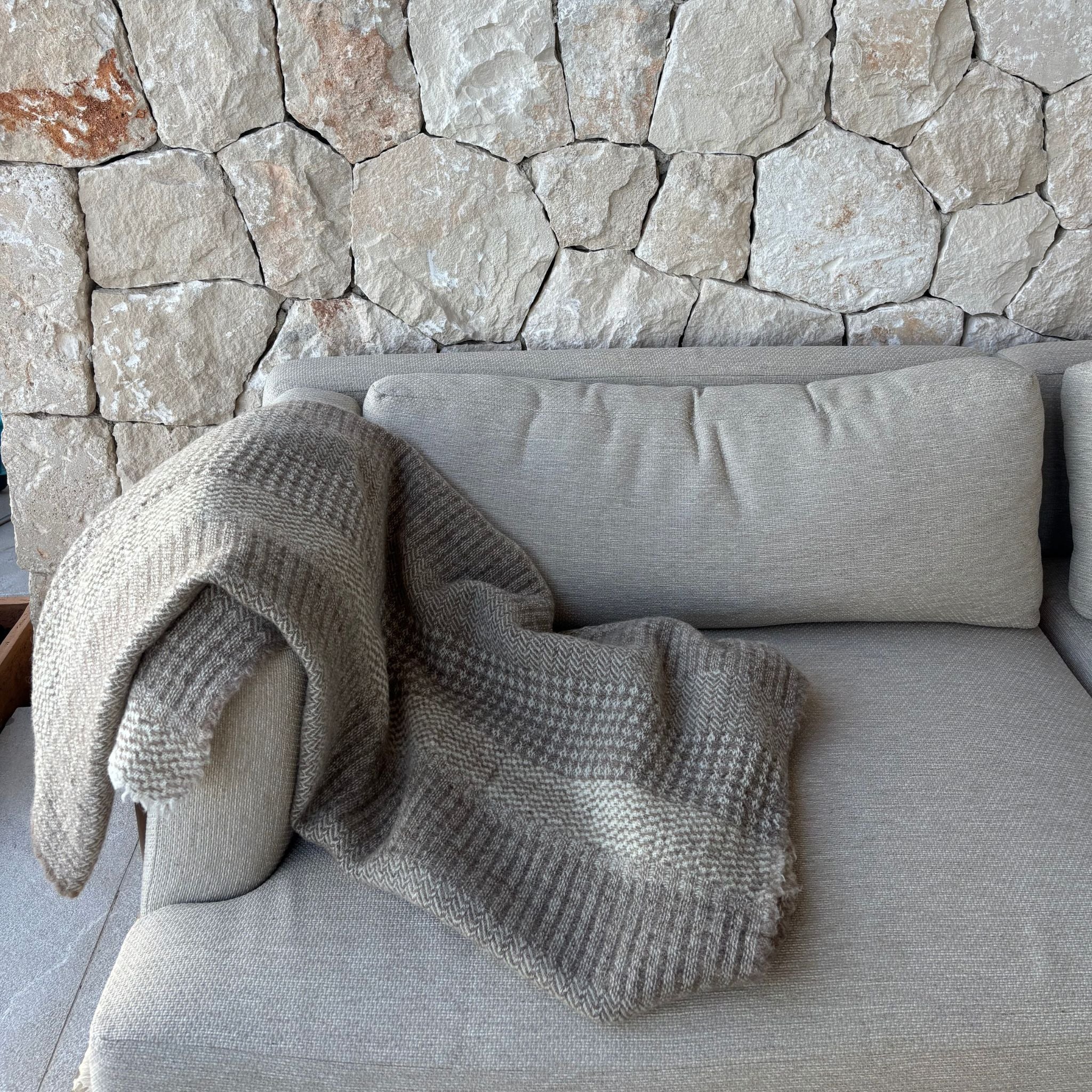 Textured Finnish wool blanket from Ekta Helsinki beige and white. Manufactured responsibly in Finland. Use for outside or inside both summer and winter. 