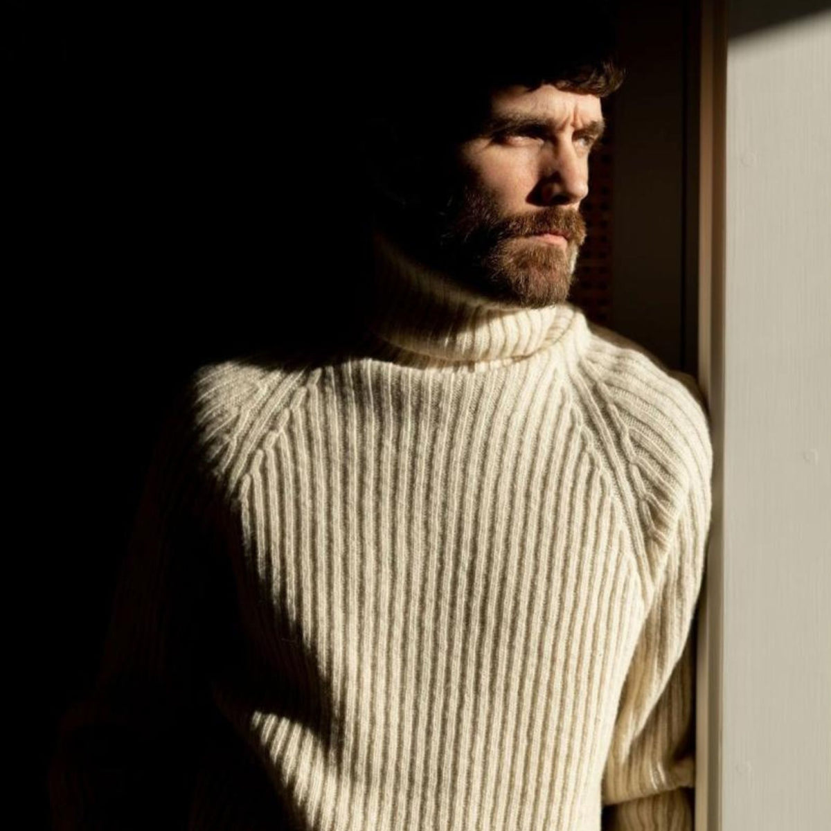 Ribbed white polo made from durable Finnish sheep wool. Sustainable and warm wool knit made in Finland. 
