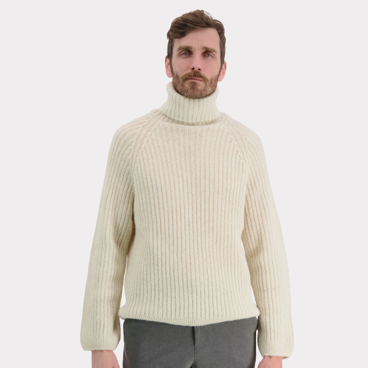 Ribbed white polo made from durable Finnish sheep wool. Sustainable and warm wool knit made in Finland. 