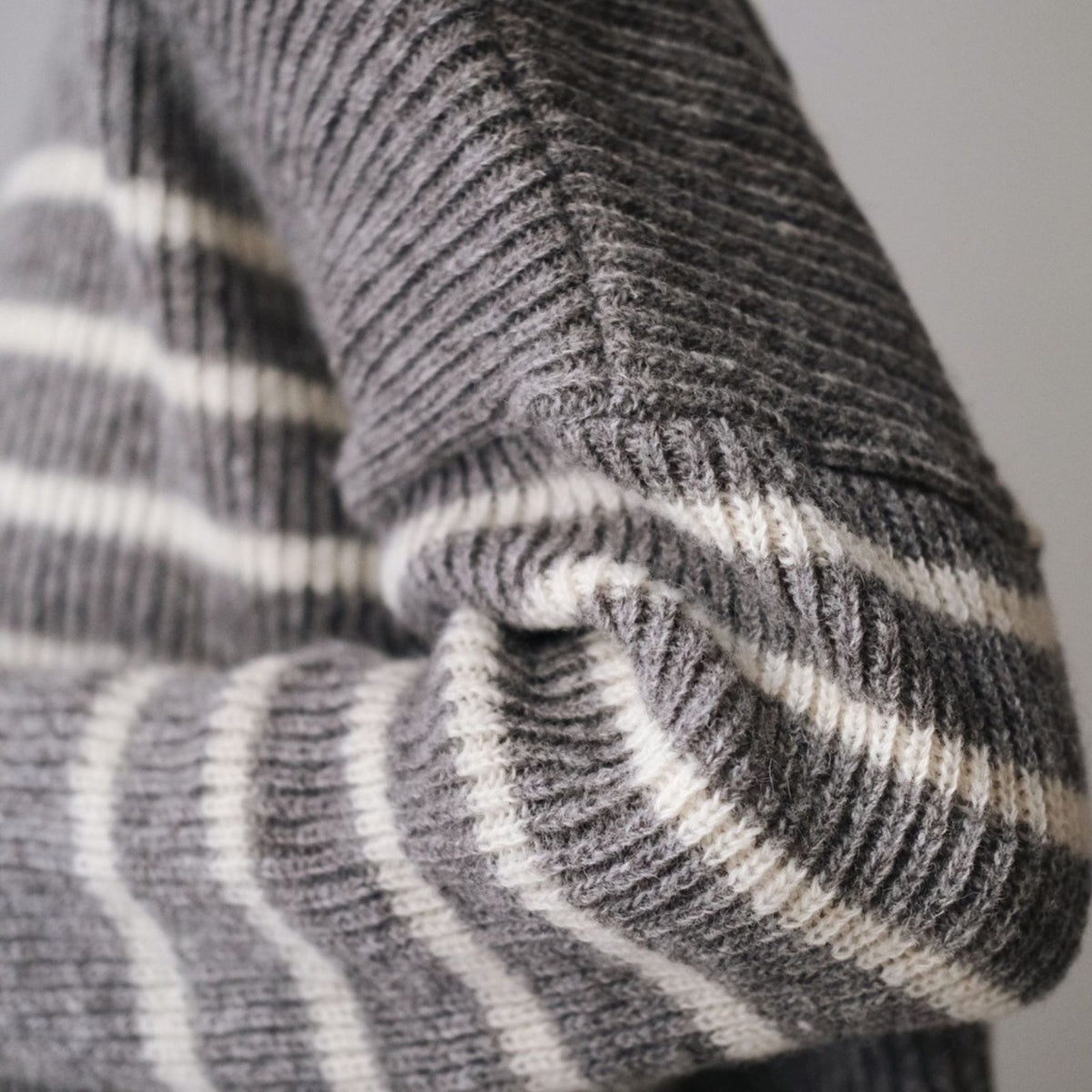 Katrine turtleneck grey striped knit made of Finnish sheep wool and manufactured responsibly in Finland. 