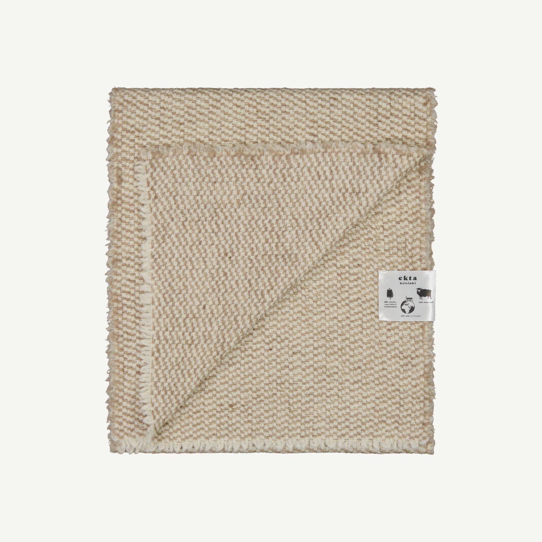 Dotted wool scarf made from 100% Finnish sheep wool, displayed folded.