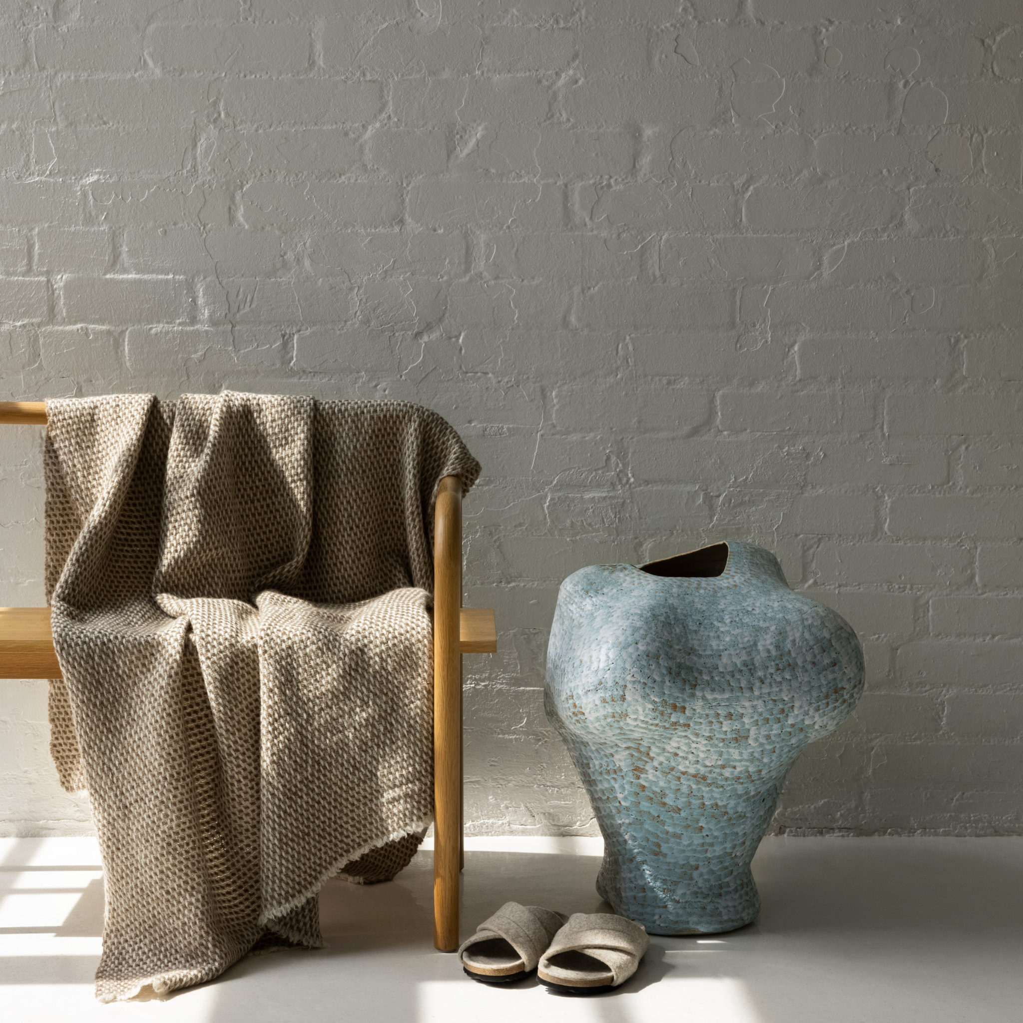Soft, warm Scandinavian wool throw in beige and white for home décor